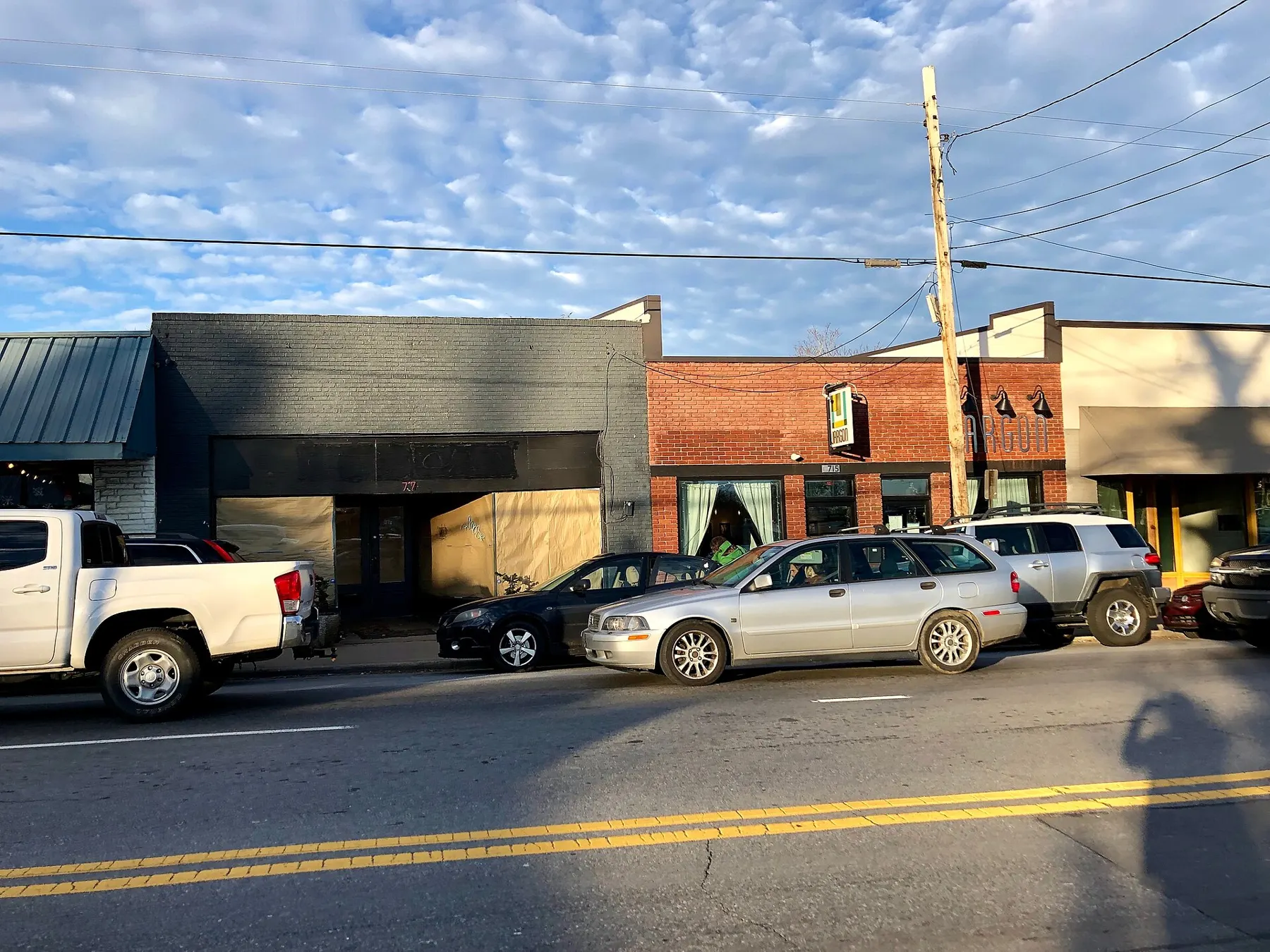 Shops and restaurants along Haywood Road in West Asheville on a sunny day